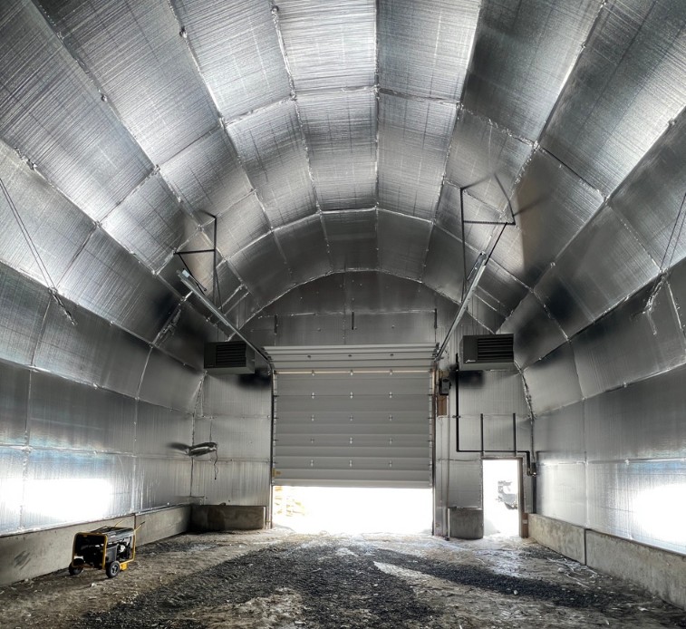 Completed foil insulation inside fabric building — Ontario